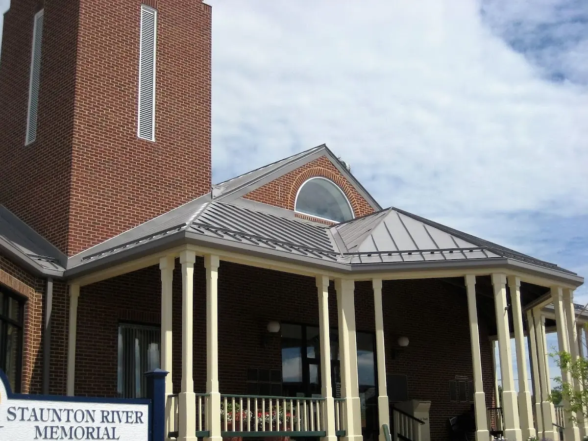 Skilled roofing craftsmen working on a residential roof in Blossom Meadows